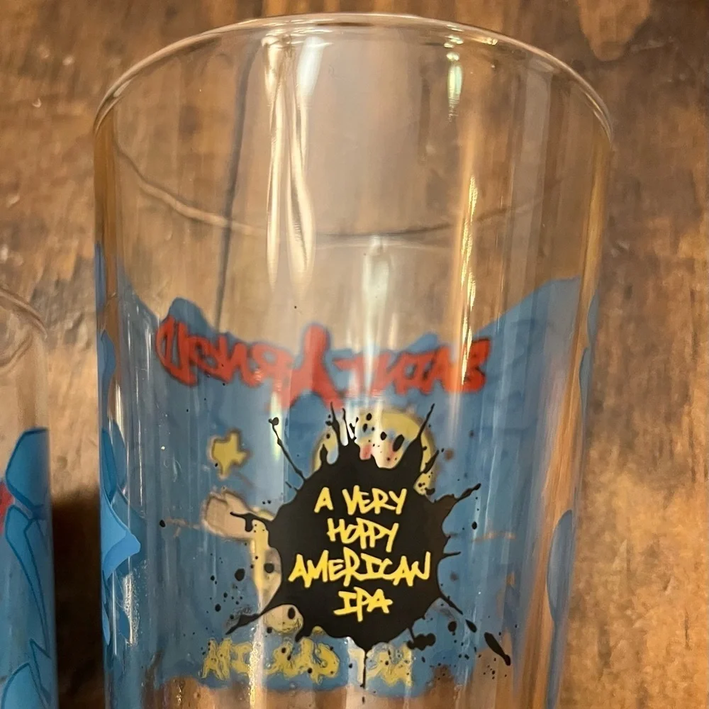2 Saint Arnold art car IPA pint glasses
